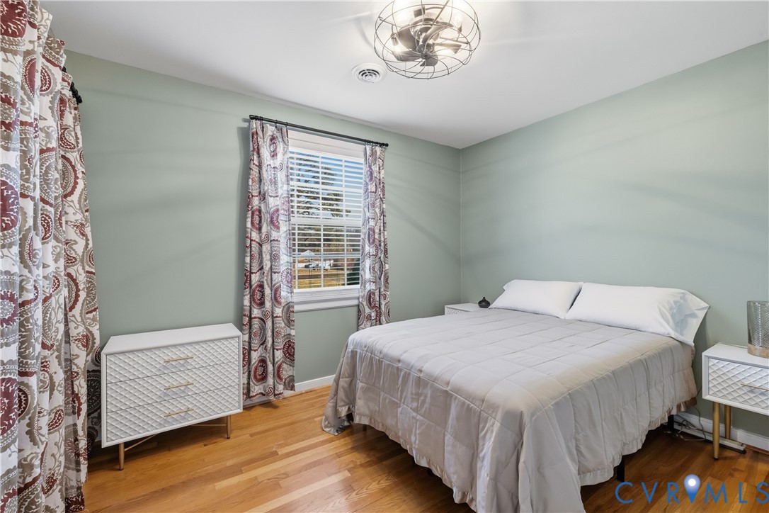 5800 West Rois Road Richmond, VA 23227 - Photo 19 of 32 a bedroom with a bed and a window