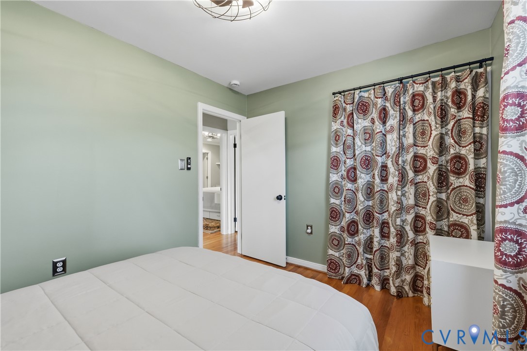 5800 West Rois Road Richmond, VA 23227 - Photo 20 of 32 a bedroom with a bed and a window