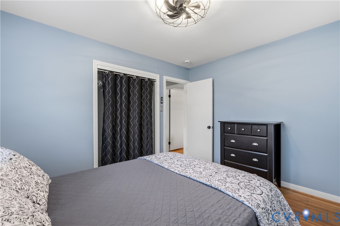 5800 West Rois Road Richmond, VA 23227 - Photo 23 of 32 a bedroom with a bed and a dresser