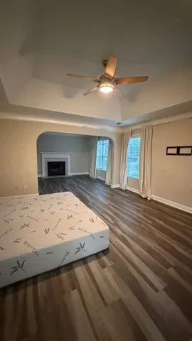 an aerial view of a house with a garden and swimming pool