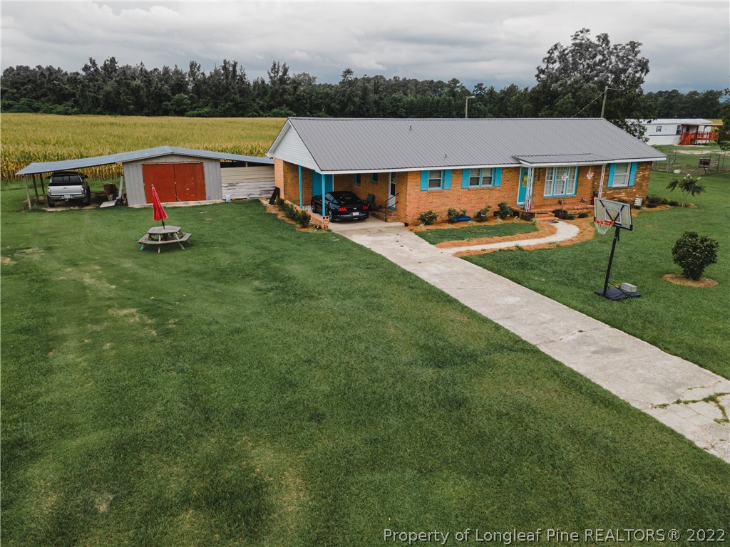 1000 Rowan Road Lumberton, NC 28358 - Photo 1 of 41 an aerial view of residential houses and lake view