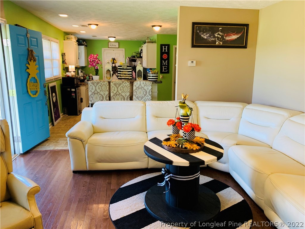 1000 Rowan Road Lumberton, NC 28358 - Photo 11 of 41 a living room with furniture and a wooden floor