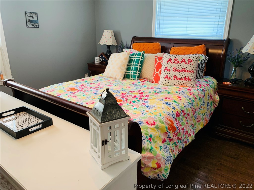 1000 Rowan Road Lumberton, NC 28358 - Photo 20 of 41 a bedroom with a bed and wooden floor