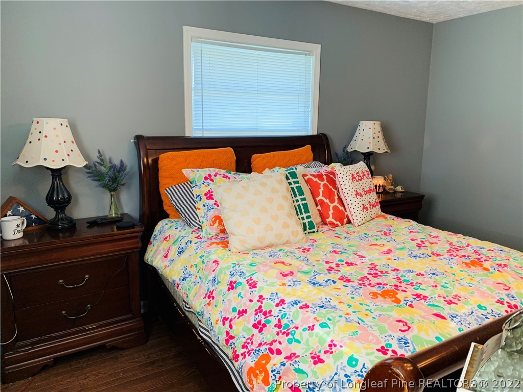 1000 Rowan Road Lumberton, NC 28358 - Photo 23 of 41 a bedroom with a bed and a dresser in it