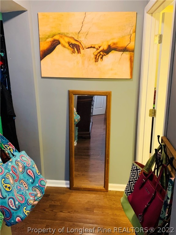 1000 Rowan Road Lumberton, NC 28358 - Photo 27 of 41 a bedroom with a bed and wooden floor