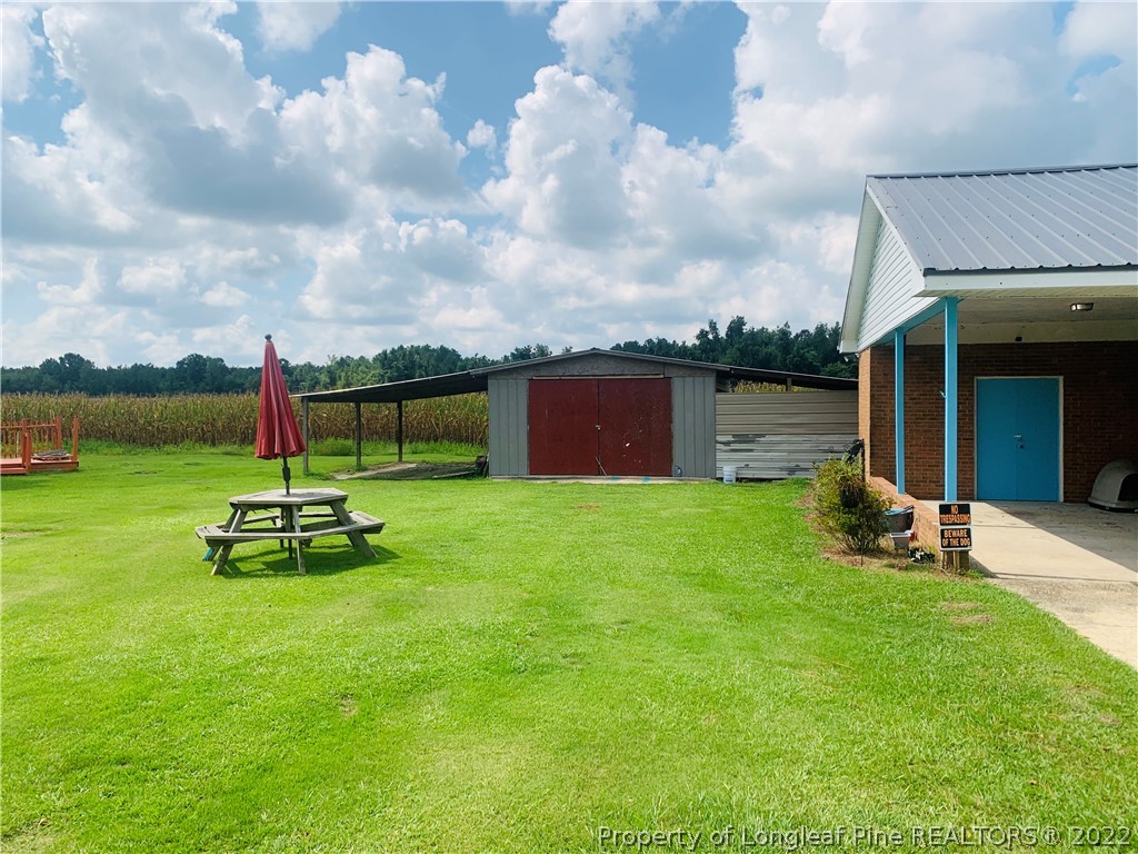 1000 Rowan Road Lumberton, NC 28358 - Photo 40 of 41 a view of a backyard with sitting area