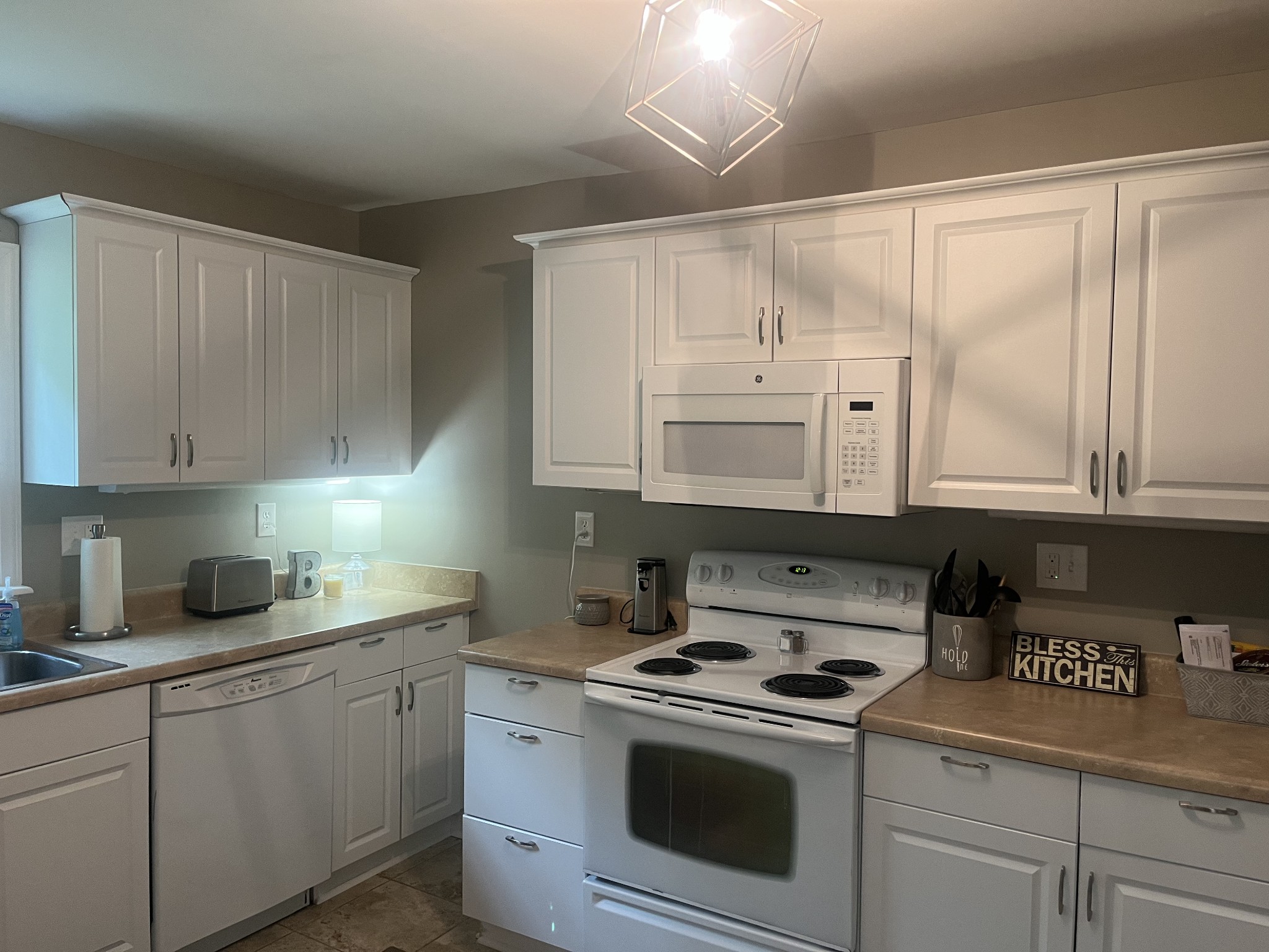107 West Songer Street Waynesboro, TN 38485 - Photo 13 of 26 a kitchen with cabinets stainless steel appliances and a sink
