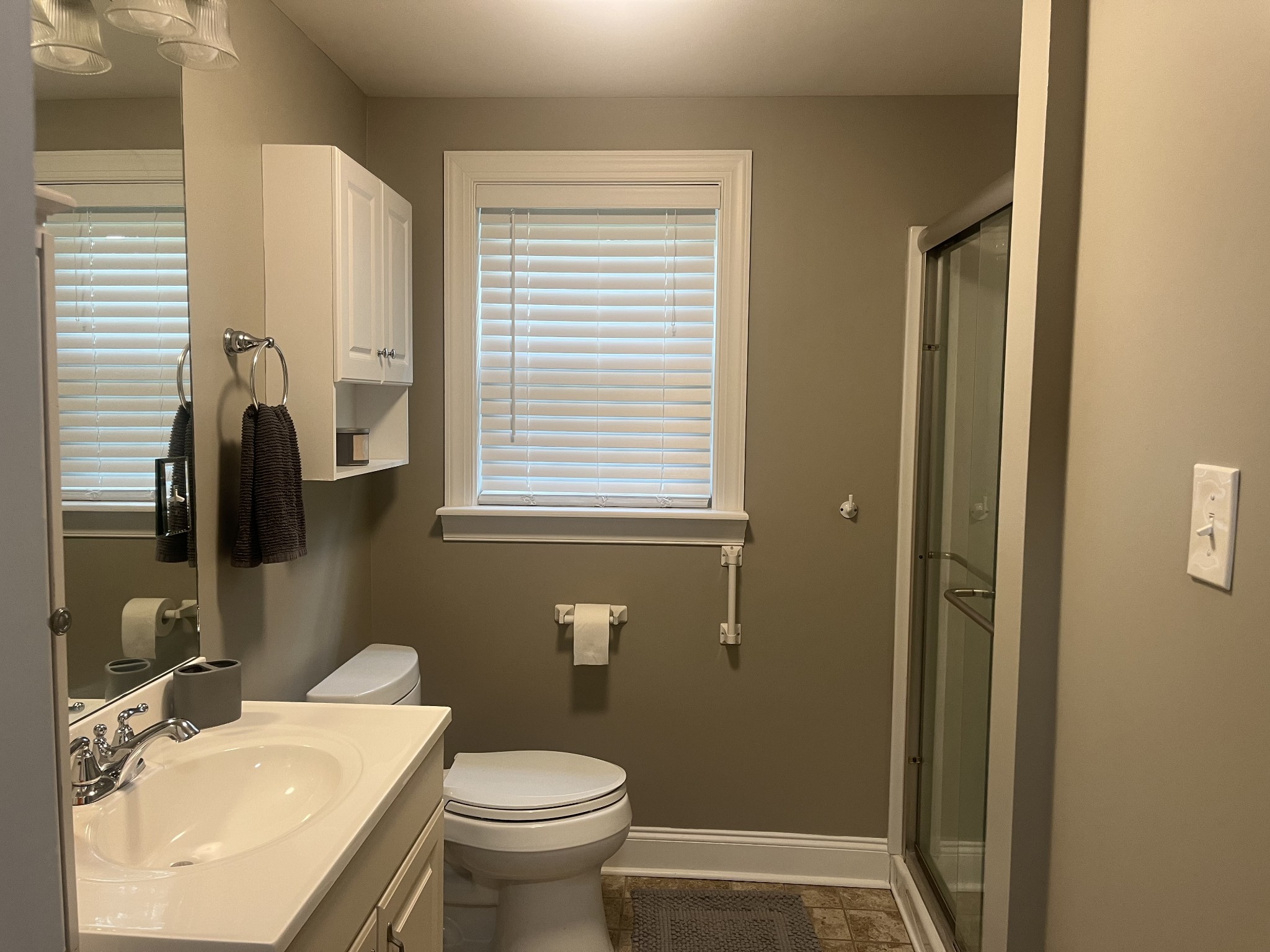 107 West Songer Street Waynesboro, TN 38485 - Photo 17 of 26 a bathroom with a sink a toilet and shower