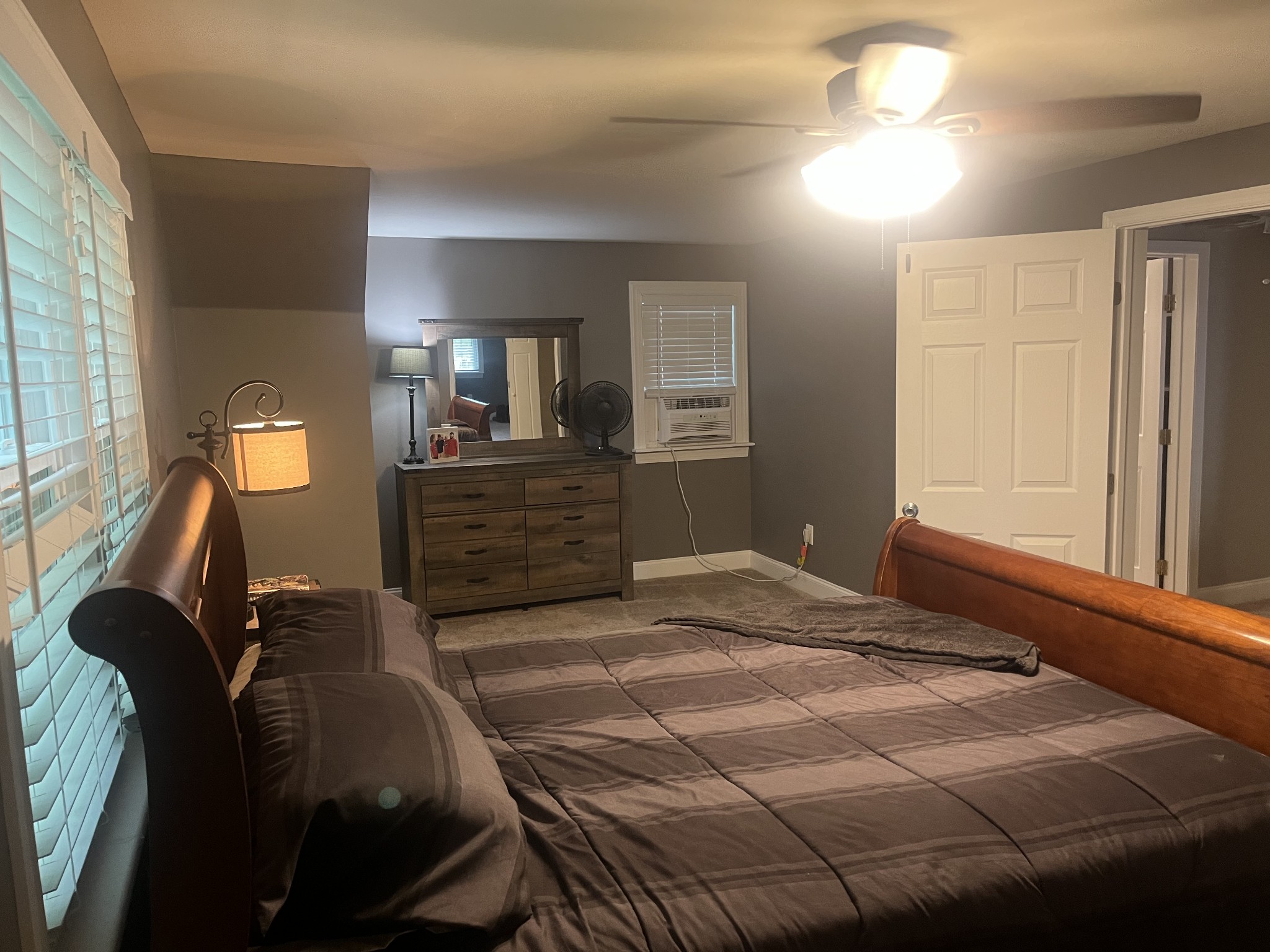 107 West Songer Street Waynesboro, TN 38485 - Photo 19 of 26 a bedroom with a bed and closet with mirror