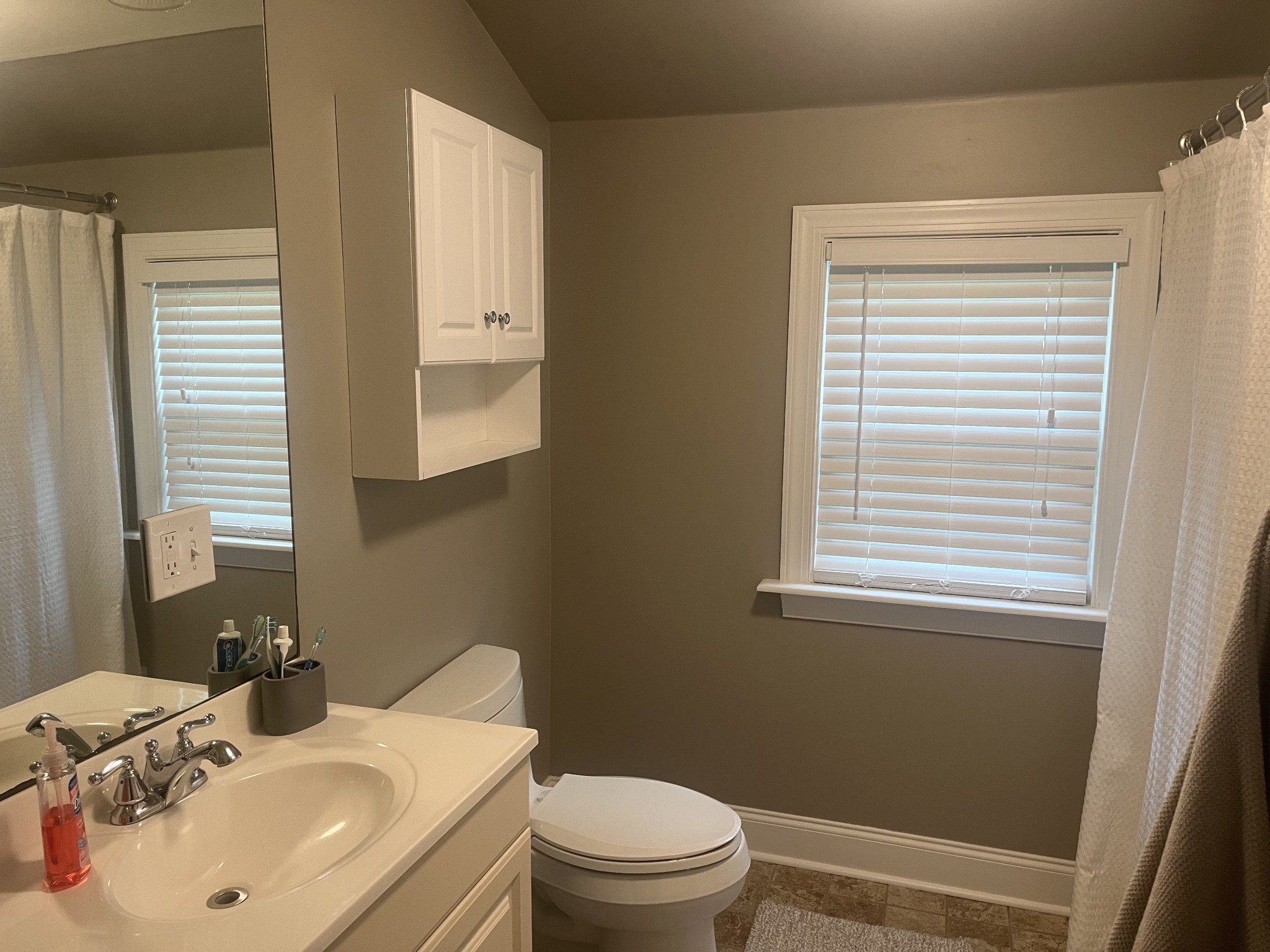 107 West Songer Street Waynesboro, TN 38485 - Photo 24 of 26 a bathroom with a sink toilet and mirror
