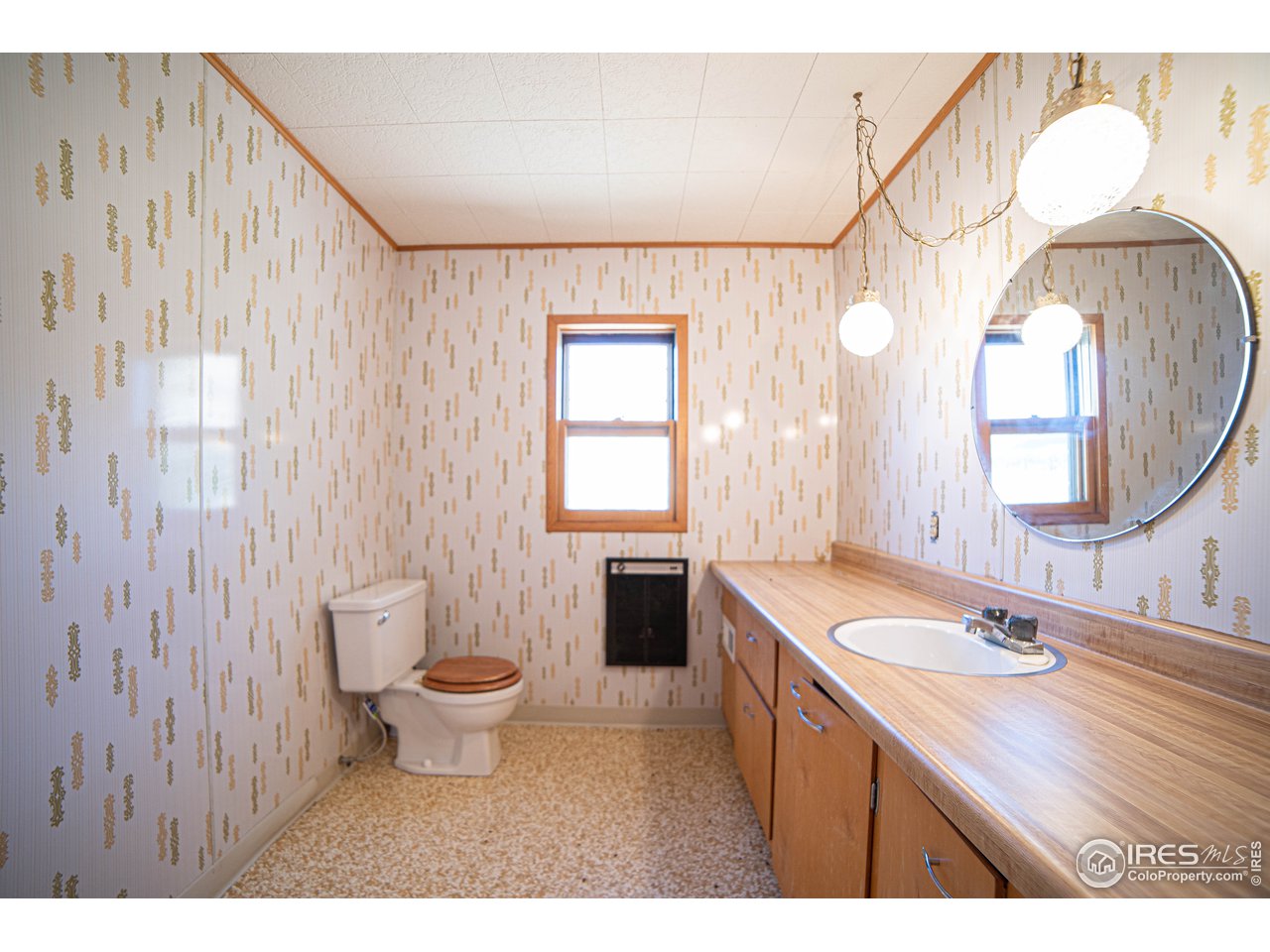 37797 Poudre Canyon Road Bellvue, CO 80512 - Photo 12 of 15 a bathroom with a sink a toilet a mirror and a tub