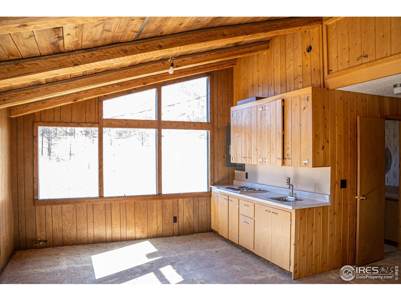 37797 Poudre Canyon Road Bellvue, CO 80512 - Photo 13 of 15 a bathroom with a sink a vanity and a mirror