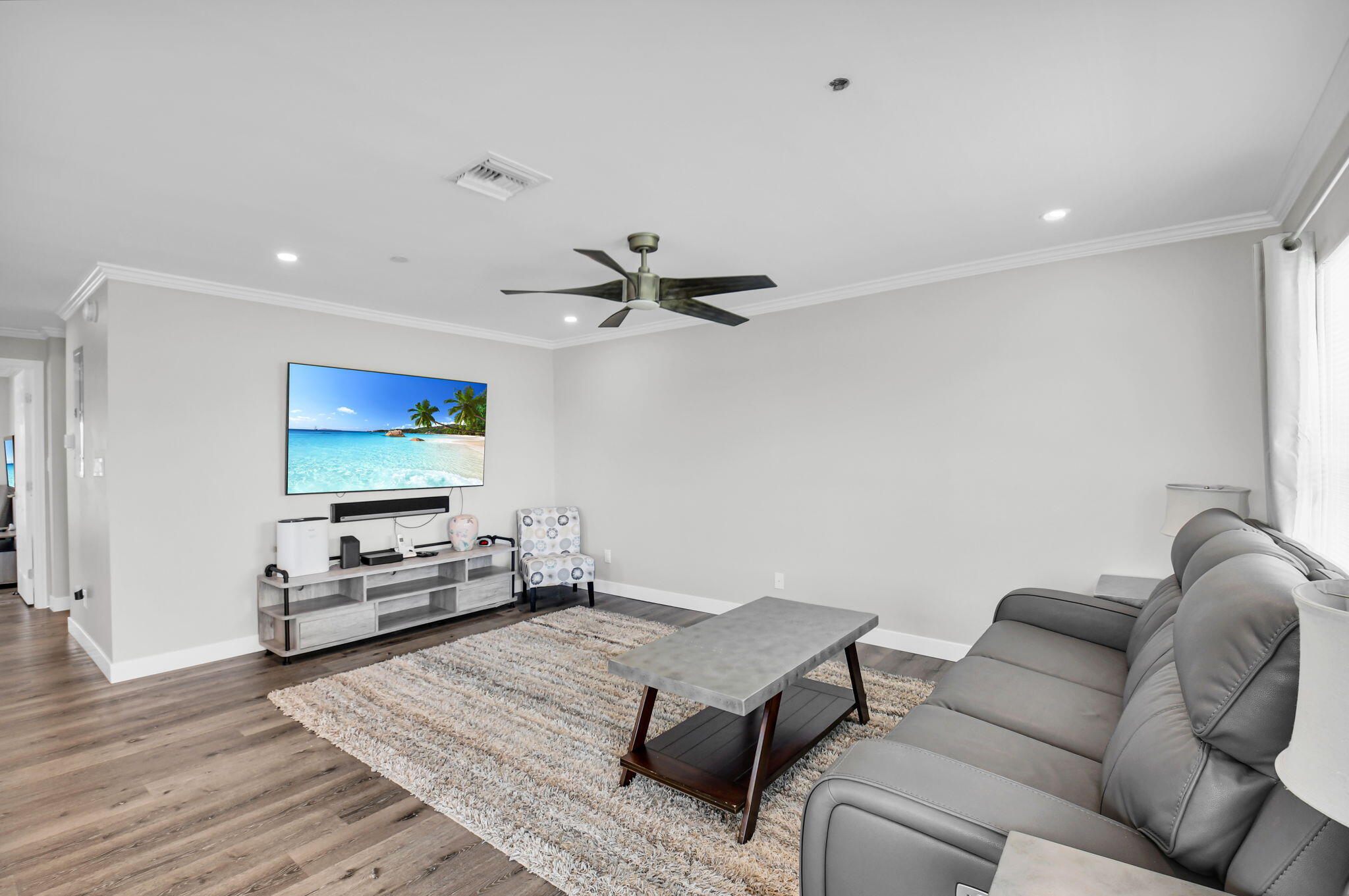 388 Tuscany Lane, Unit 388 Delray Beach, FL 33446 - Photo 5 of 40 a living room with furniture and a flat screen tv