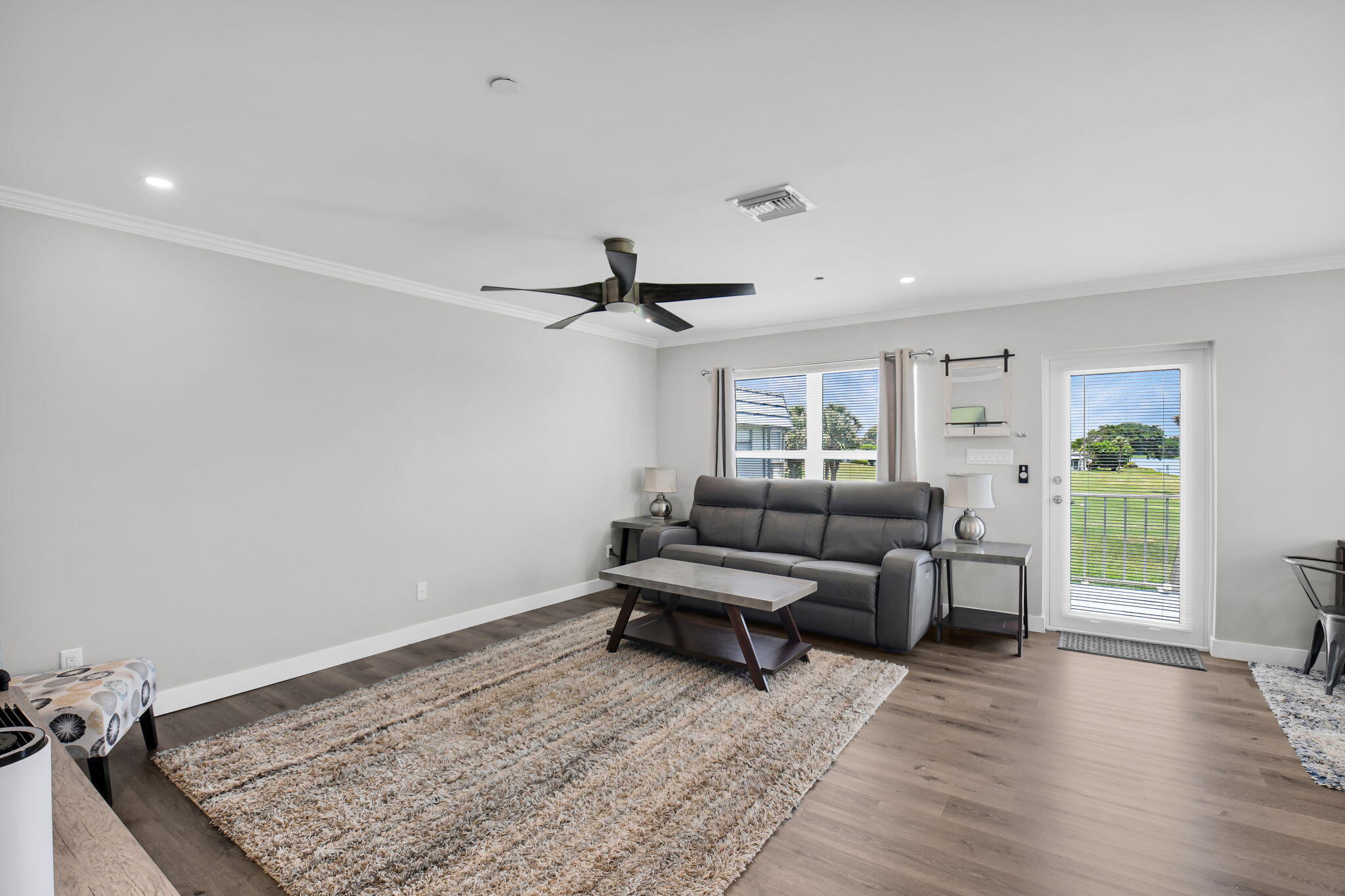 388 Tuscany Lane, Unit 388 Delray Beach, FL 33446 - Photo 6 of 40 a living room with furniture and wooden floor