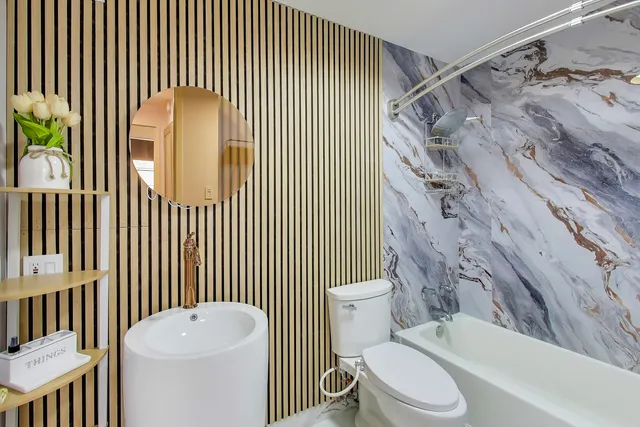 a living room with a flat screen tv and a large window