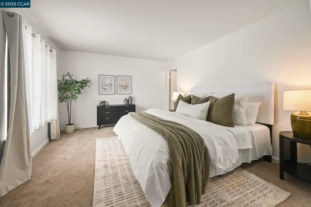 a bedroom with a bed and a couch