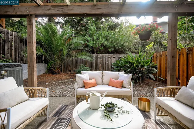 a outdoor living space with furniture and garden view
