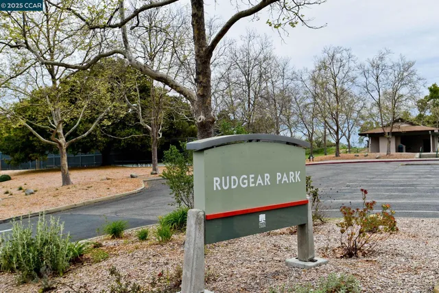 a view of a sign board with street