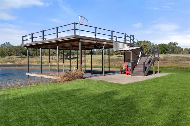 a view of a deck with a table and chairs
