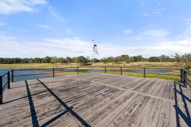a view of outdoor space with trees and buildings in the background