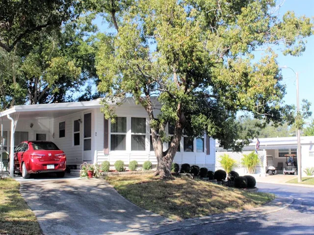 a view of a car parked in front of a house