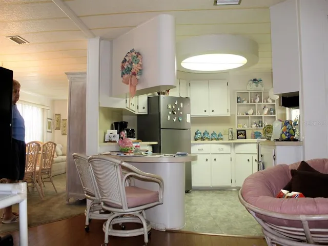 a room with a workspace and a window