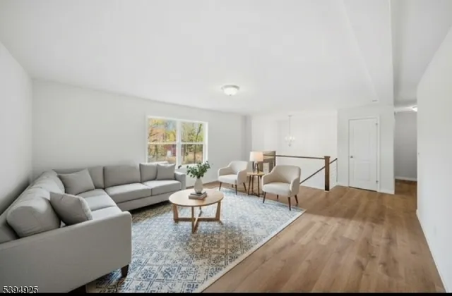 a living room with furniture and a rug