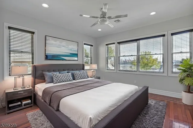 a bedroom with a large bed and a window