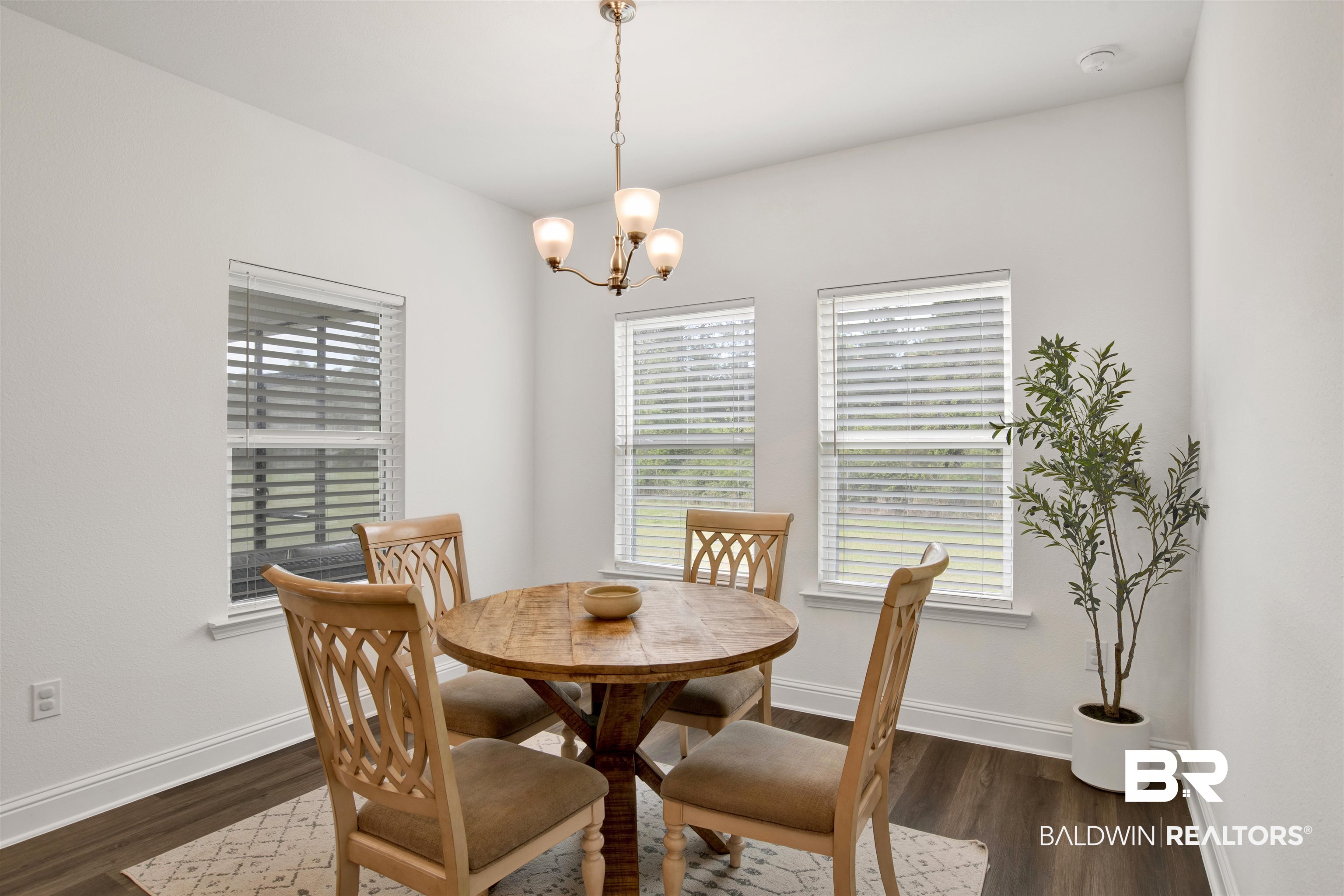 594 Shepard Street Gulf Shores, AL 36542 - Photo 20 of 51 Dining space featuring suspended lighting and dark wood-style flooring