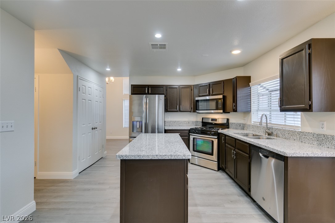 1738 Toltec Circle Henderson, NV 89014 - Photo 10 of 46 Culinary creations come to life in this kitchen, featuring an island for preparation and abundant cabinetry.