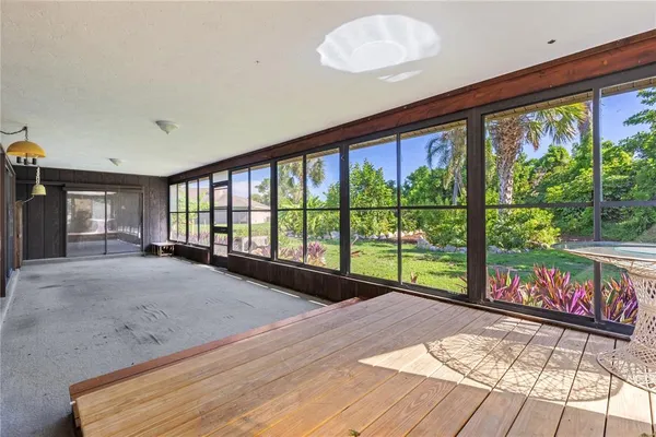 a view of a porch with wooden floor and outdoor space