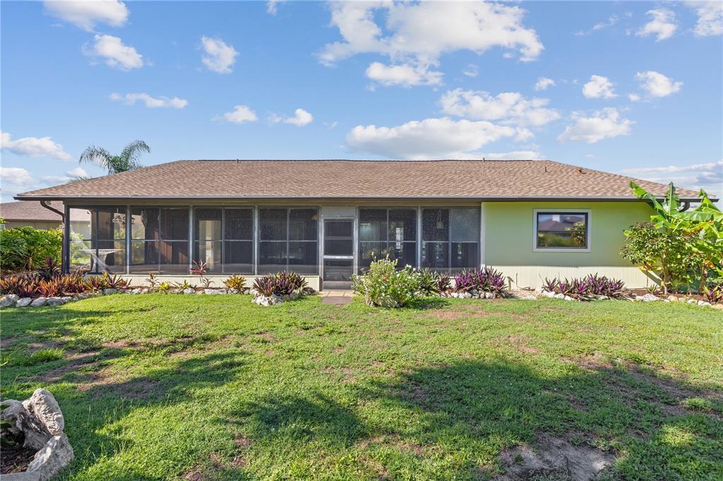 1315 Pine Needle Road Venice, FL 34285 - Photo 16 of 52 a front view of a house with a garden