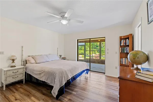 a bedroom with a bed and large window