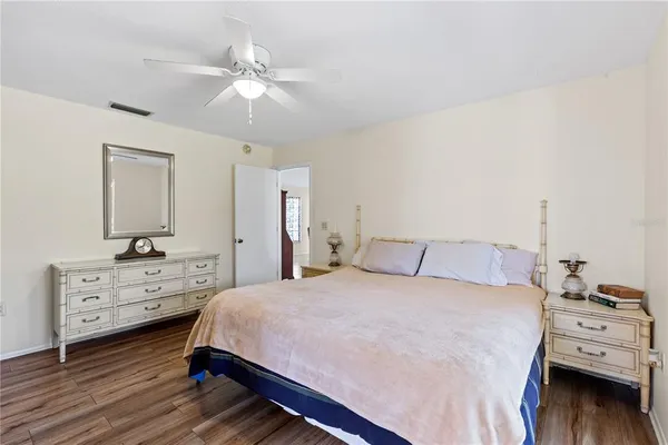 a bedroom with a bed and a dresser
