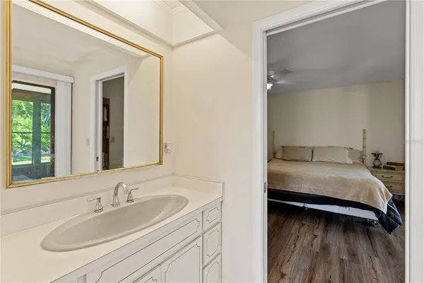 a en suite bathroom with a sink and a mirror