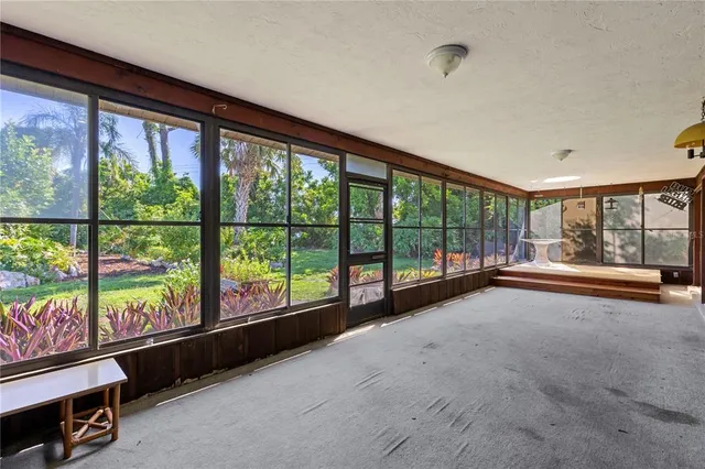 a view of an empty room with a large window