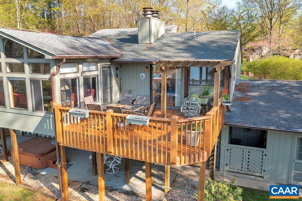 3 Laguna Road Palmyra, VA 22963 - Photo 27 of 39 a view of a patio with table and chairs with wooden floor and fence