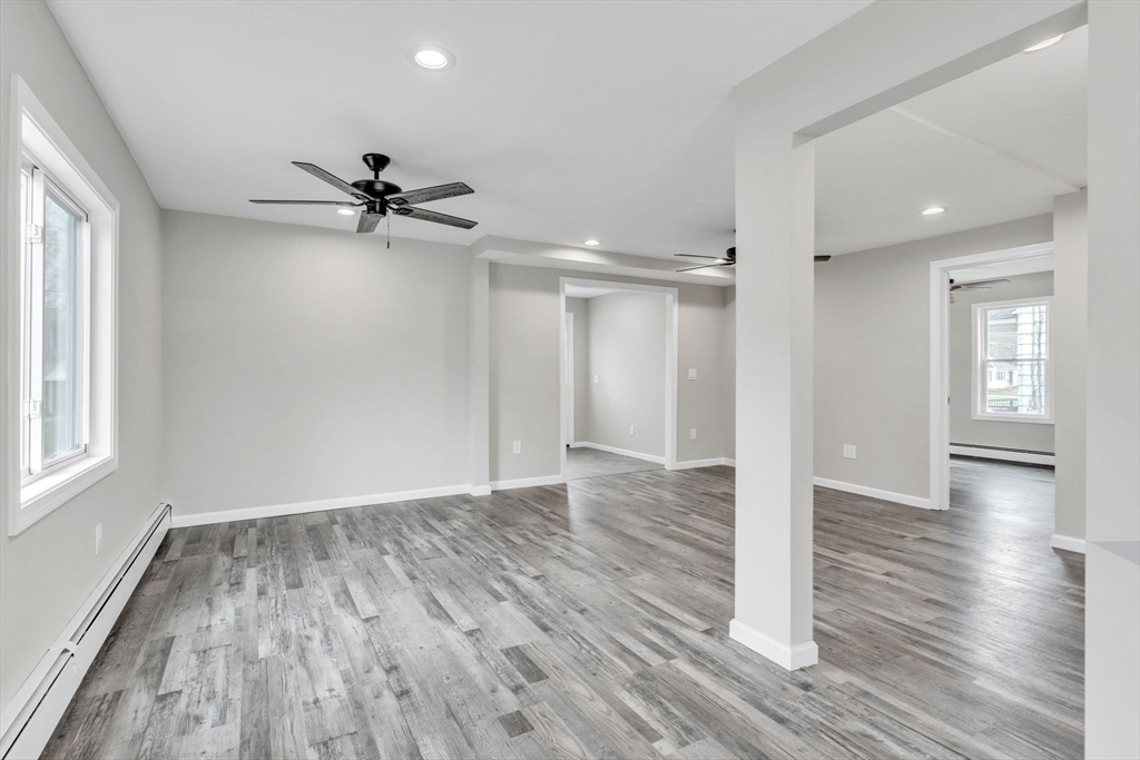 74 Ruggles Street Three Rivers, MA 01080 - Photo 11 of 42 a view of empty room with wooden floor and fan