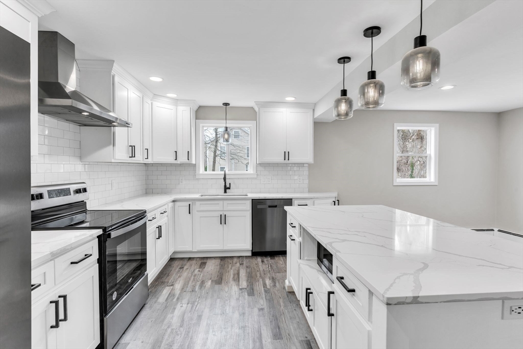 74 Ruggles Street Three Rivers, MA 01080 - Photo 12 of 42 a kitchen with a sink stove and cabinets
