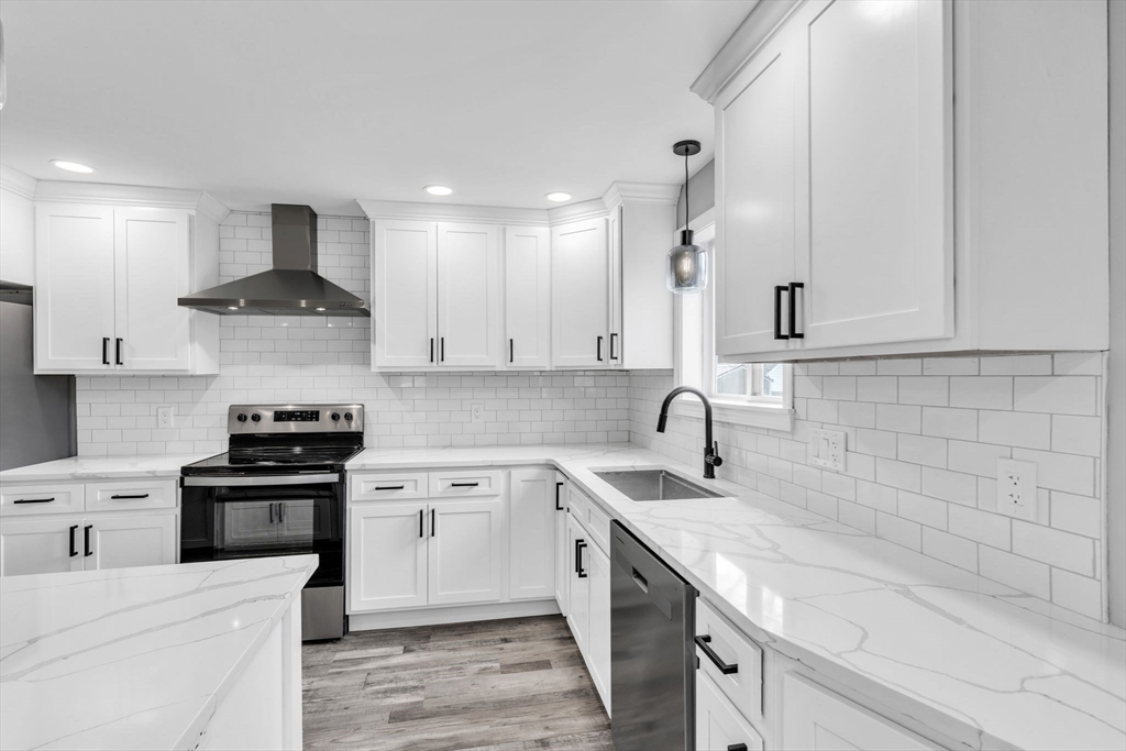 74 Ruggles Street Three Rivers, MA 01080 - Photo 16 of 42 a kitchen with a sink stove and cabinets