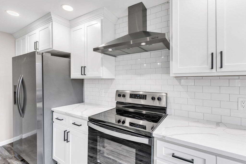 74 Ruggles Street Three Rivers, MA 01080 - Photo 18 of 42 a kitchen with a refrigerator and a stove