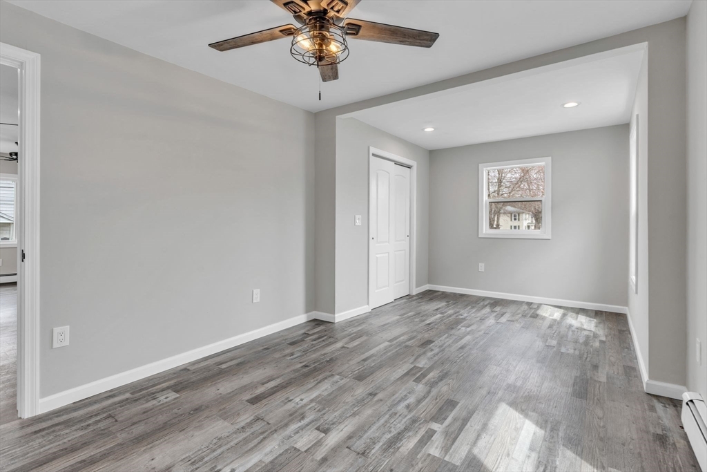 74 Ruggles Street Three Rivers, MA 01080 - Photo 21 of 42 wooden floor in an empty room with a window