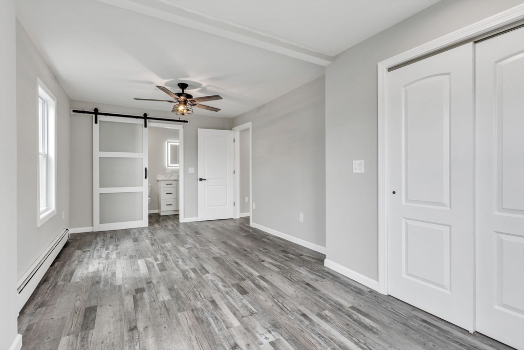 74 Ruggles Street Three Rivers, MA 01080 - Photo 22 of 42 wooden floor in an empty room with a window