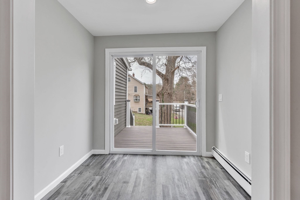 74 Ruggles Street Three Rivers, MA 01080 - Photo 25 of 42 wooden floor in an empty room with a window