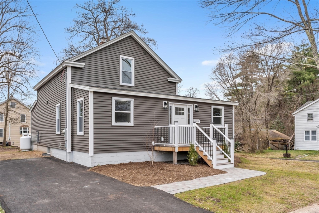 74 Ruggles Street Three Rivers, MA 01080 - Photo 3 of 42 a view of a house with a patio