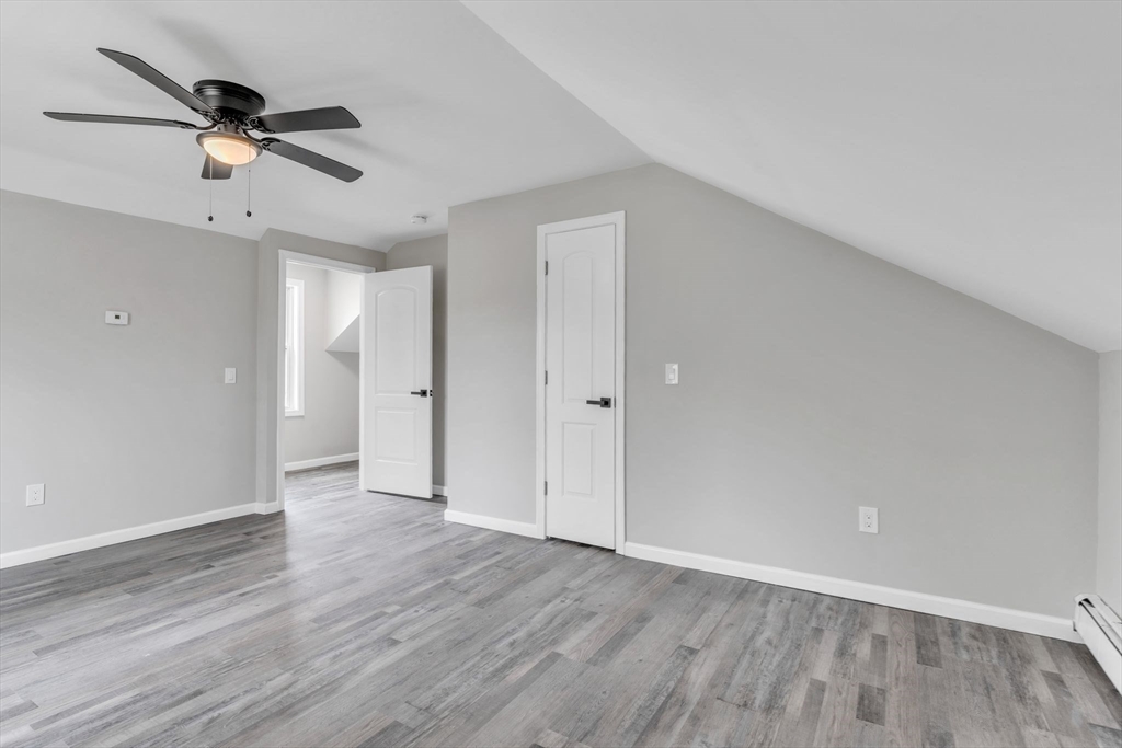 74 Ruggles Street Three Rivers, MA 01080 - Photo 32 of 42 a view of an empty room and wooden floor