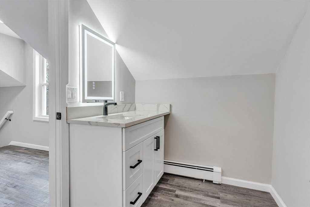 74 Ruggles Street Three Rivers, MA 01080 - Photo 34 of 42 a bathroom with a sink vanity and a mirror