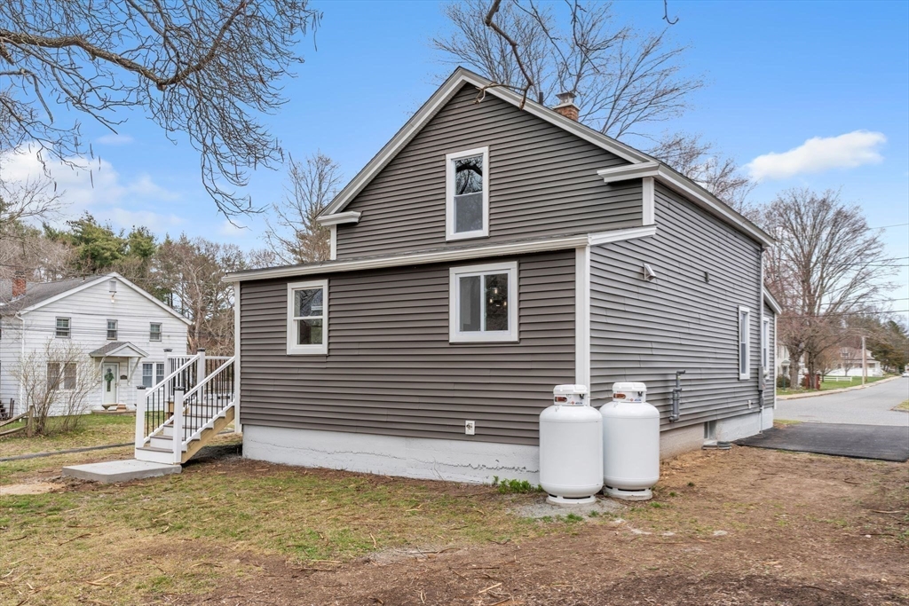 74 Ruggles Street Three Rivers, MA 01080 - Photo 36 of 42 a view of a house with a patio and backyard