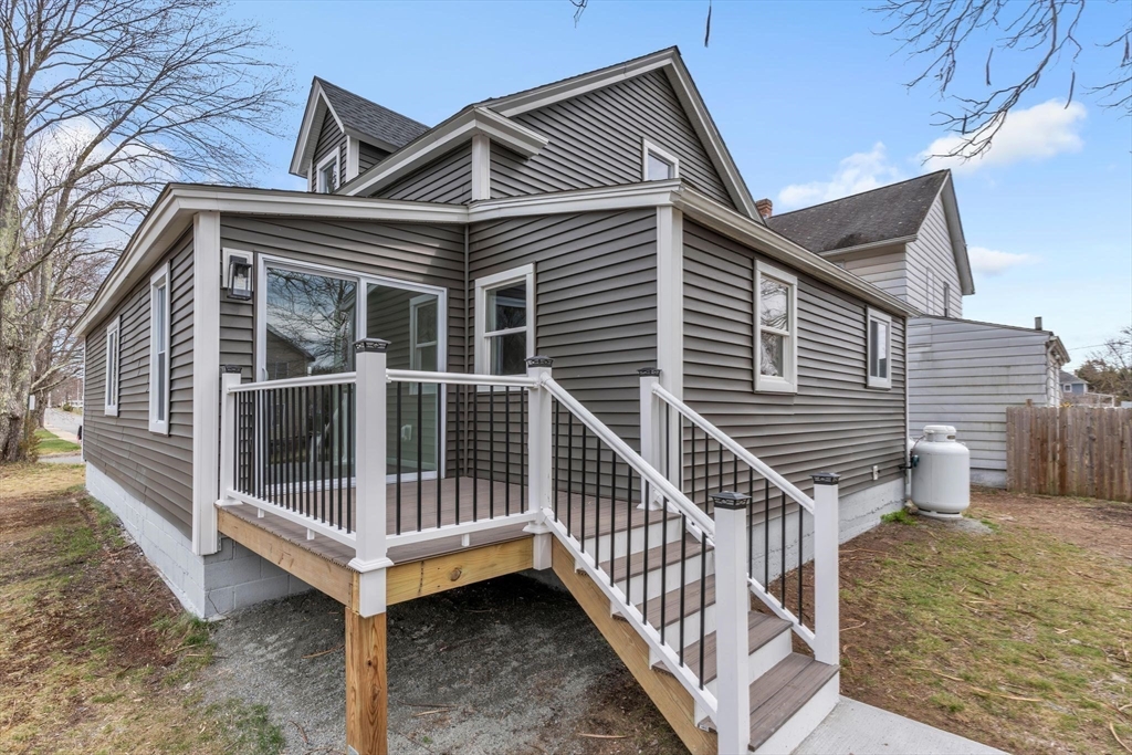 74 Ruggles Street Three Rivers, MA 01080 - Photo 37 of 42 a front view of a house with wooden deck