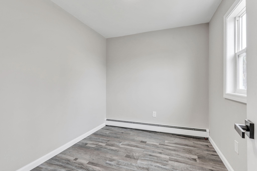 74 Ruggles Street Three Rivers, MA 01080 - Photo 7 of 42 a view of an empty room and window